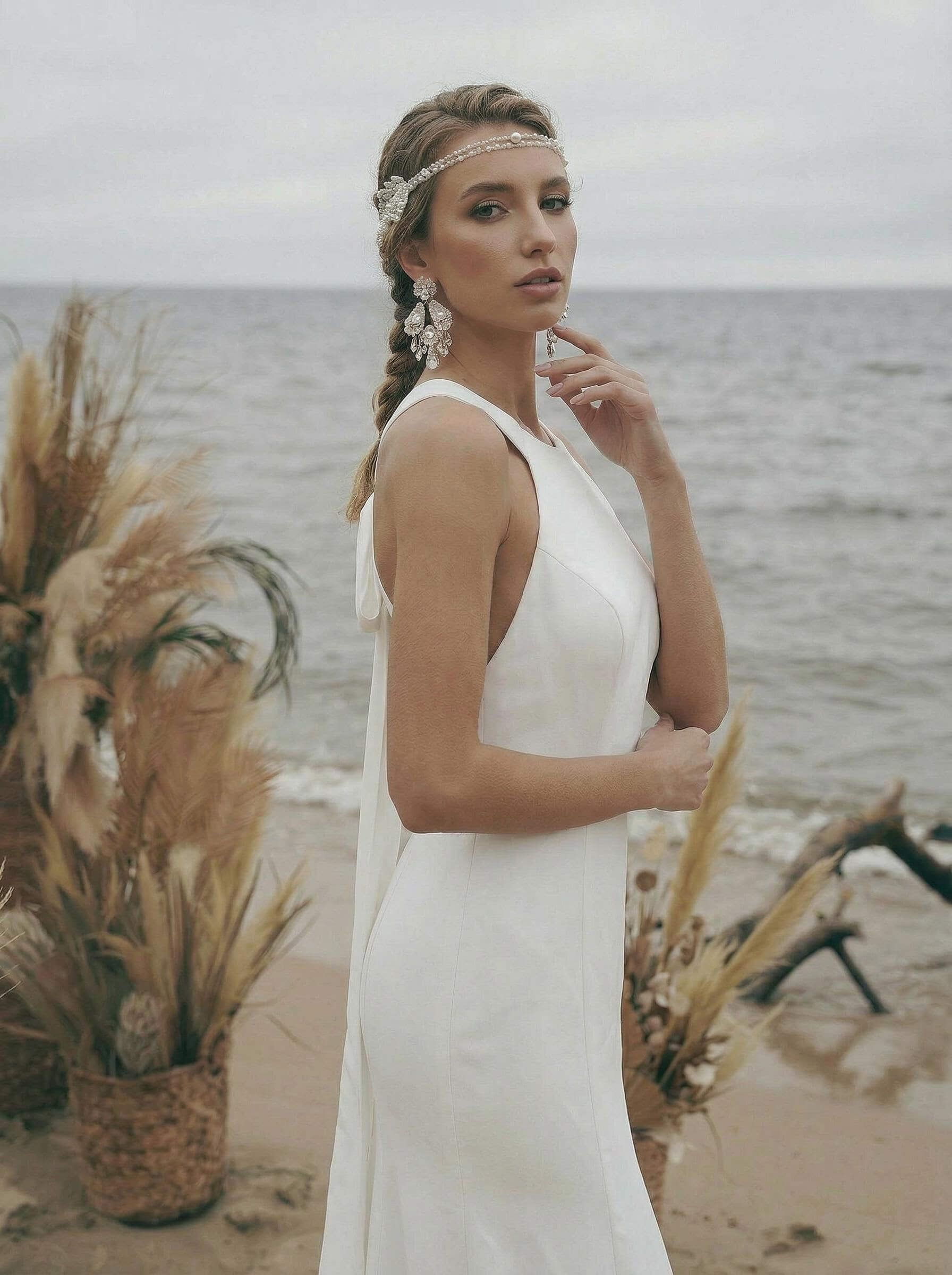 Trumpet/Mermaid Sleeveless Halter Elastic Satin Sweep Train Wedding Dresses With Bow(s)