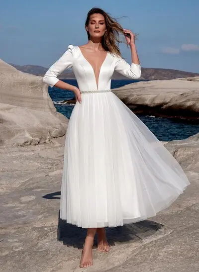 short sleeve wedding dress Camille the dress showcases a graceful silhouette with a subtle leg slit for added movement Short Sleeves Wedding Dresses &