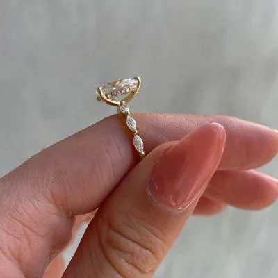 Fancy Pear Cut Women's Ring With Accent Band In Gold