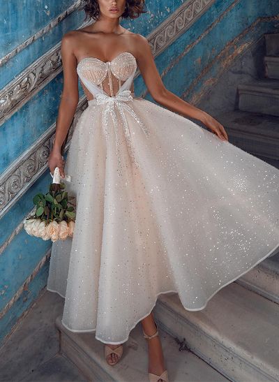 A-Line Sweetheart Sleeveless Sequined Wedding Dresses With Bow(s)