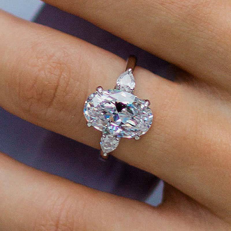 Outstanding Oval Cut Three Stone Engagement Ring