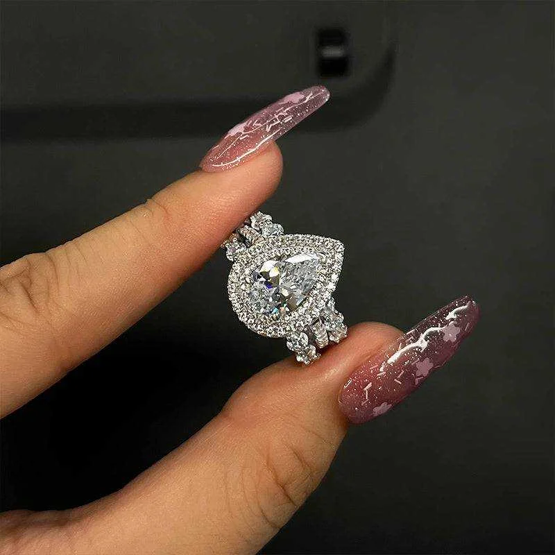 Eternity Double Halo Pear Cut 3-Pieces Wedding Set In Sterling Silver