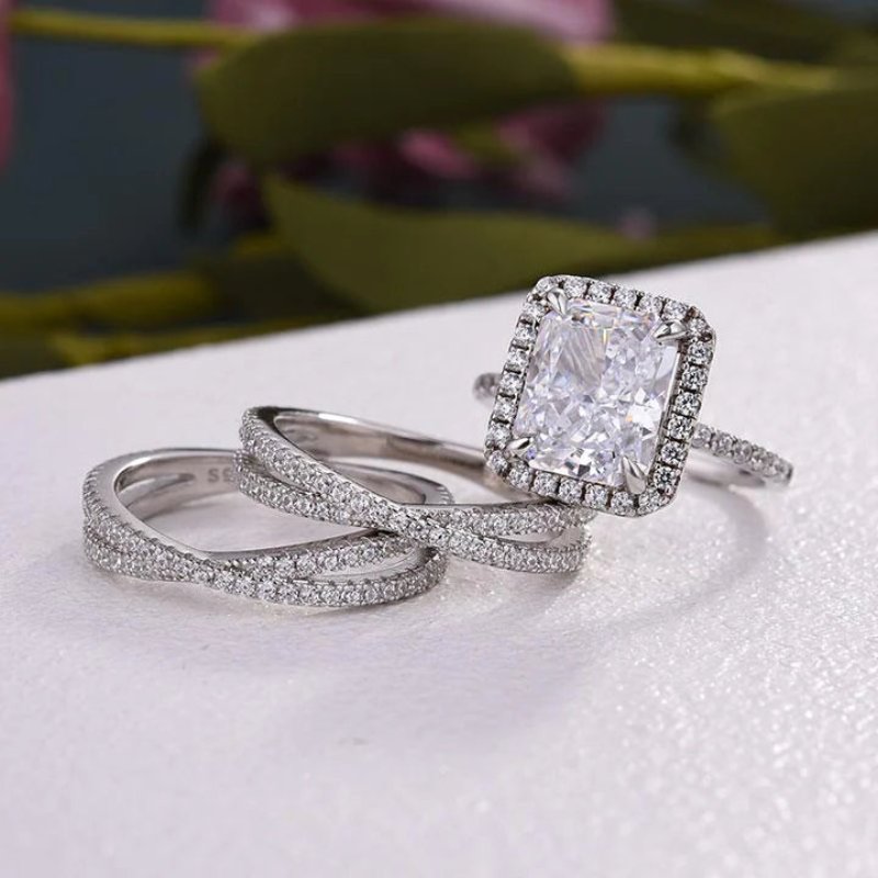 Luxurious Halo Radiant Cut Sterling Silver Bridal Set With Two Interweave Bands