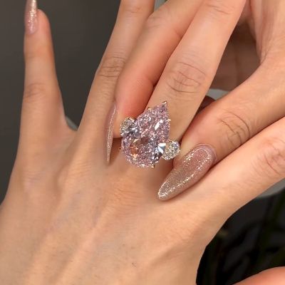 Gorgeous Pear Cut Pink Sapphire Three Stone Engagement Ring
