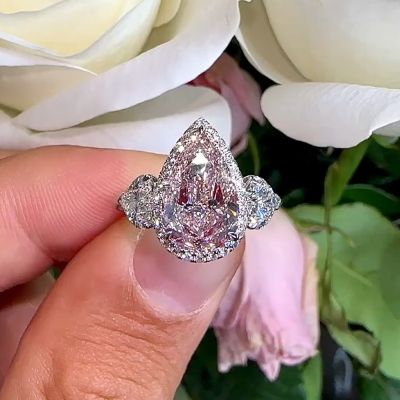 Gorgeous Pear Cut Pink Sapphire Three Stone Engagement Ring
