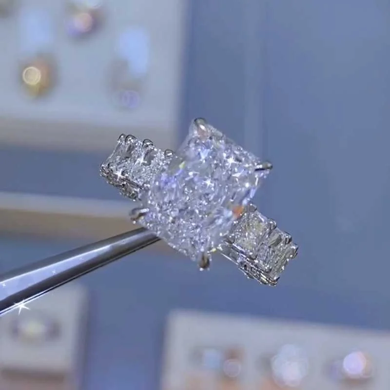 Classic Emerald Cut Moissanite Engagement Ring In Sterling Silver