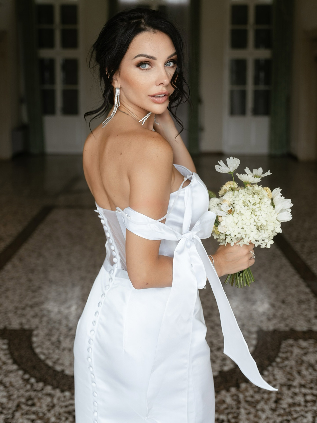 A love story written in every detail. 🤍✨ We are completely spellbound by @yelisavietareal in our dreamy white MISSACC gown.  From the elegant row of pearl buttons to the romantic satin bow straps, this dress is designed for your most unforgettable milestones. Saying "I do" to perfection starts here. Say yes to your dream dress at missacc.com. 👰‍♀️